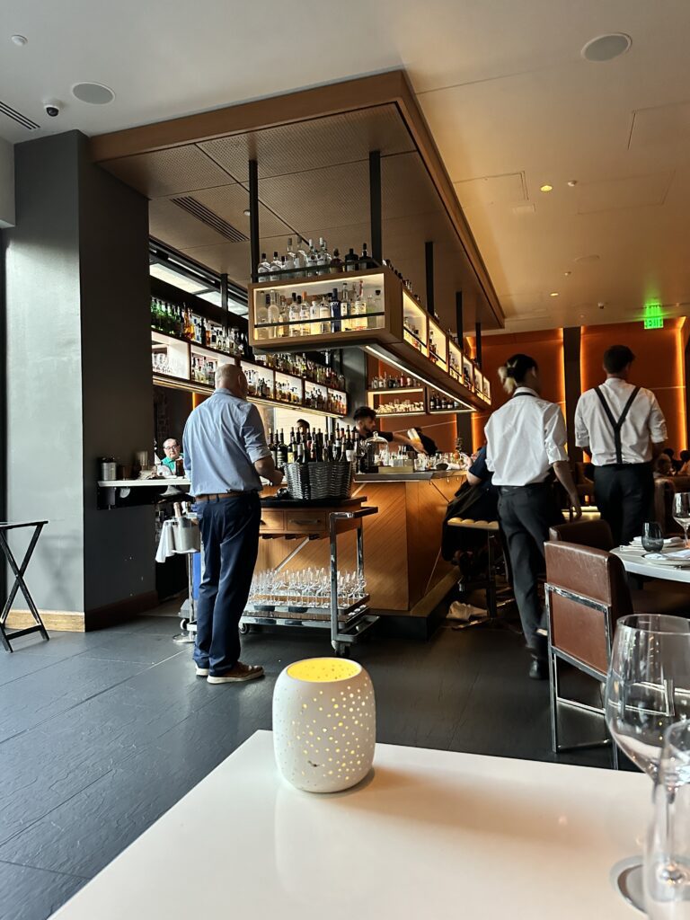 a group of people standing in a restaurant