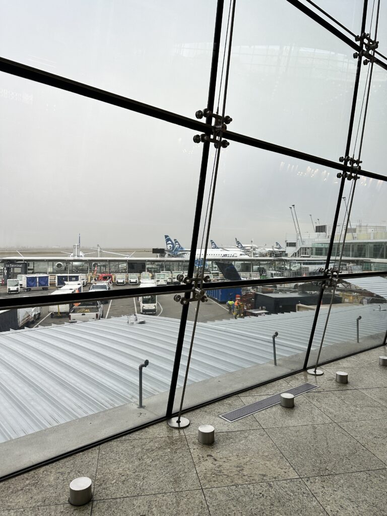 a view of a large glass window at an airport