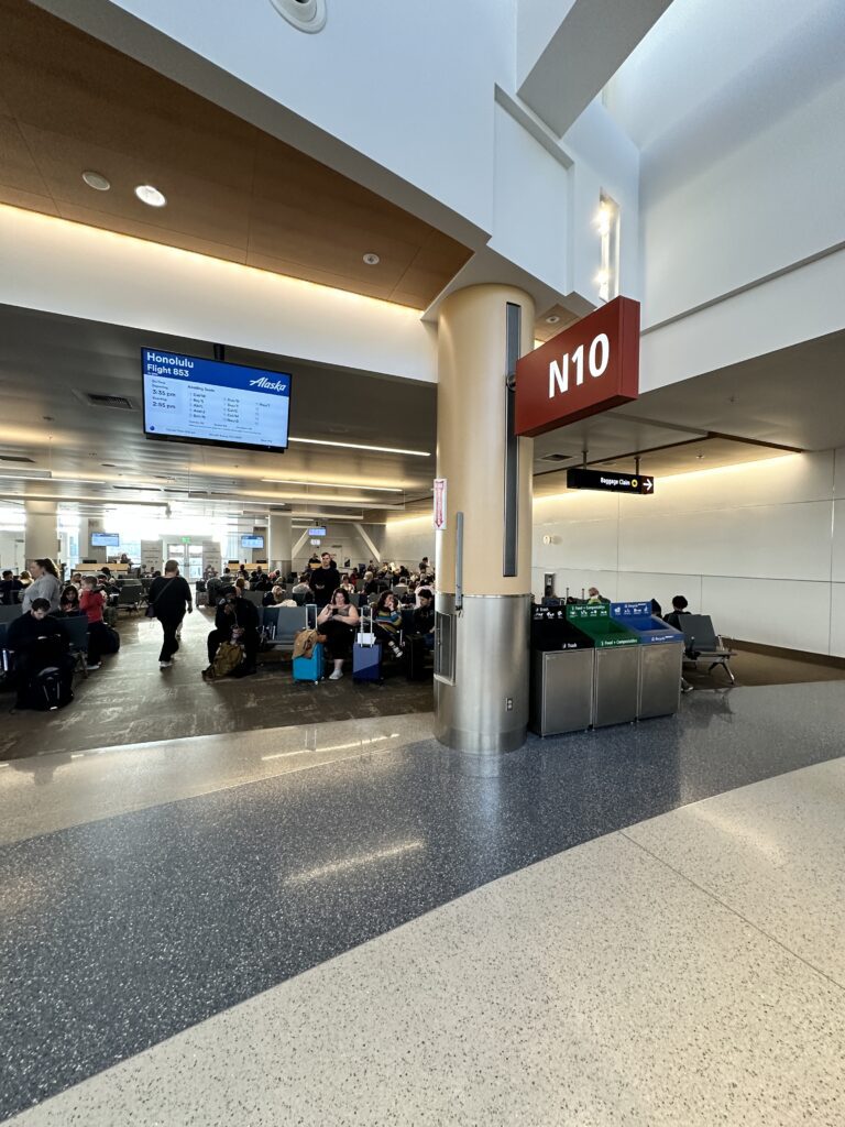 a group of people sitting in a terminal