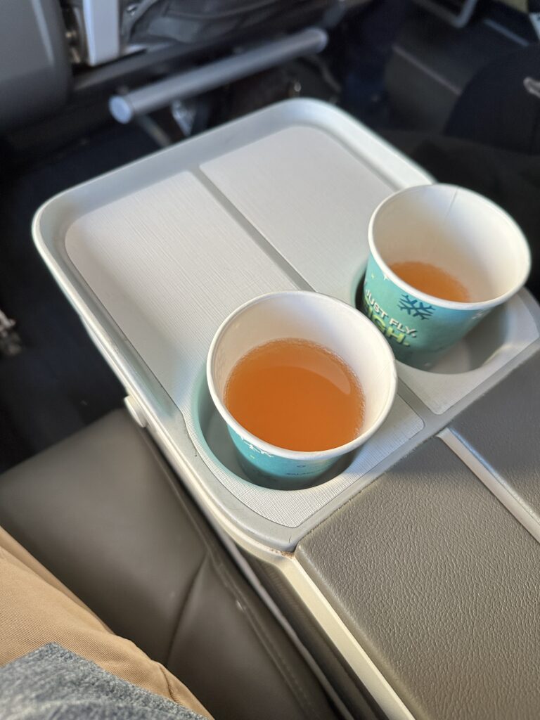 two cups of liquid on a tray