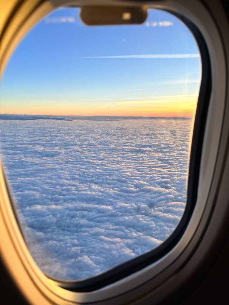 a view of clouds from an airplane window