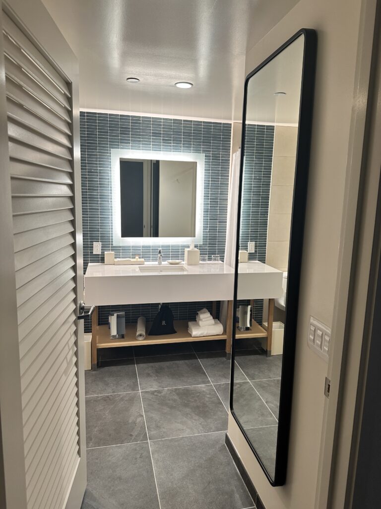 a bathroom with a mirror and sink