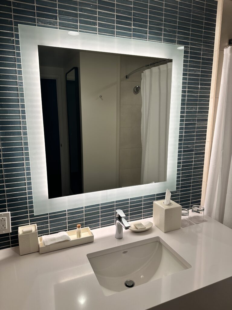 a mirror above a sink