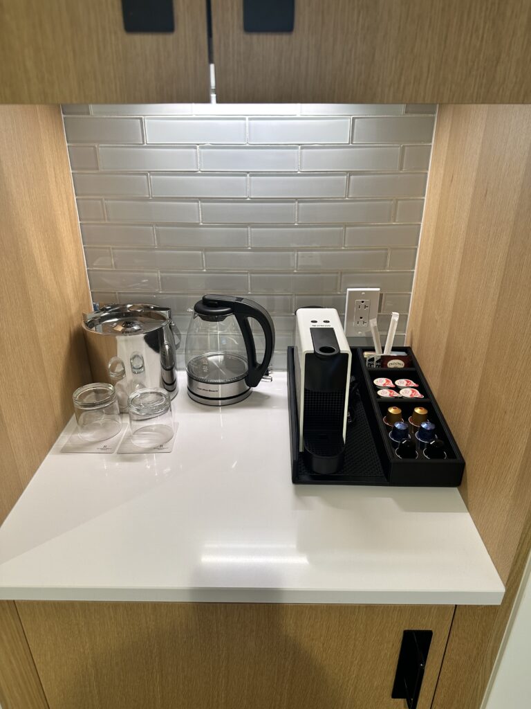 a coffee maker and coffee pot on a counter