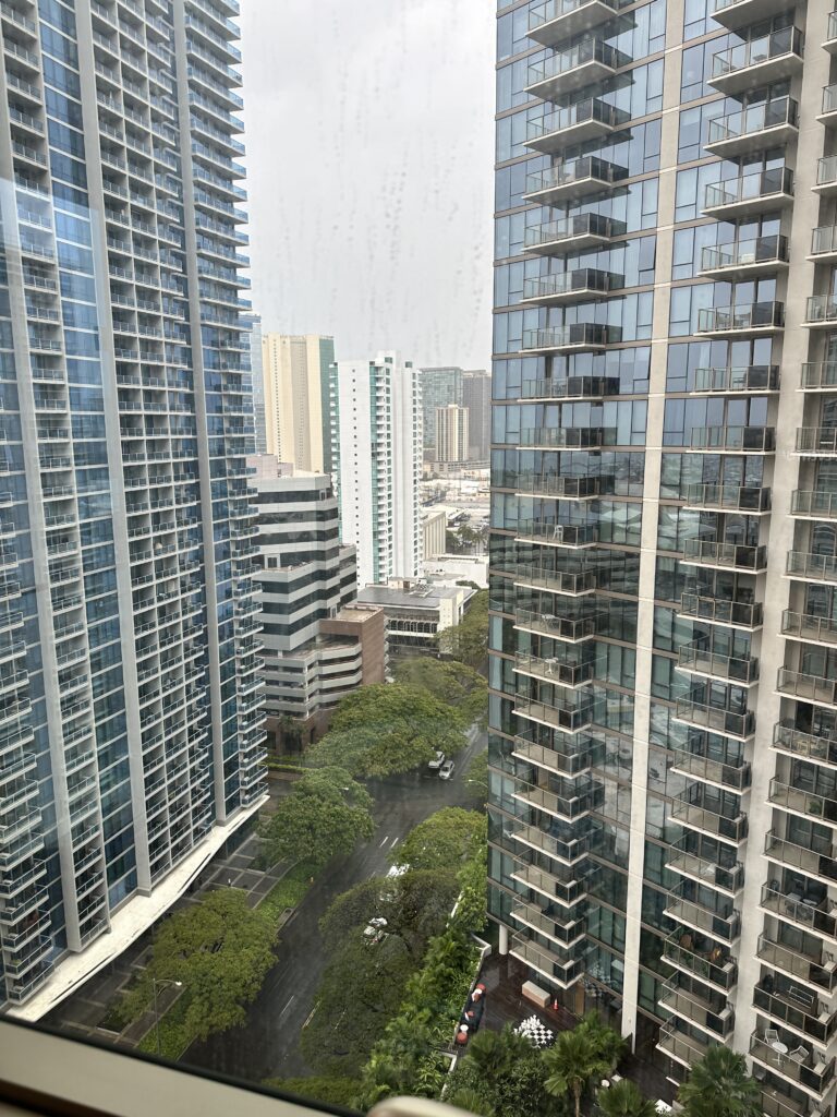 a group of tall buildings with trees