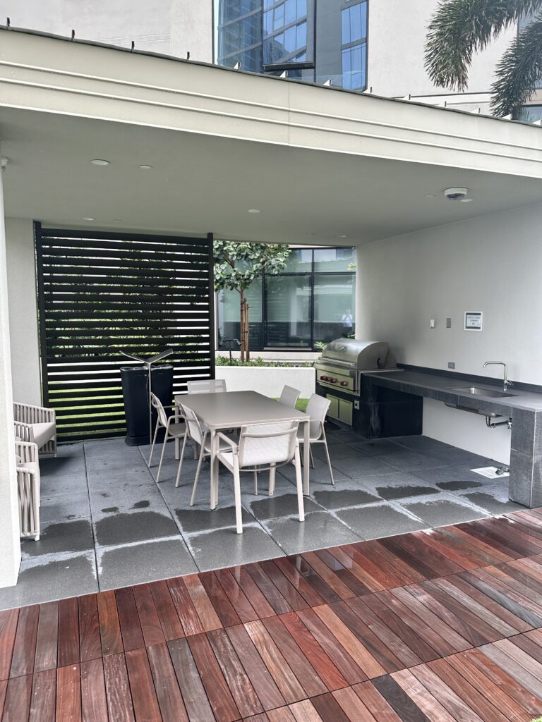 a patio with a table and chairs