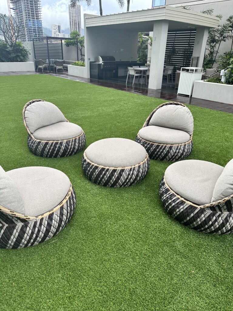 a group of chairs on a lawn