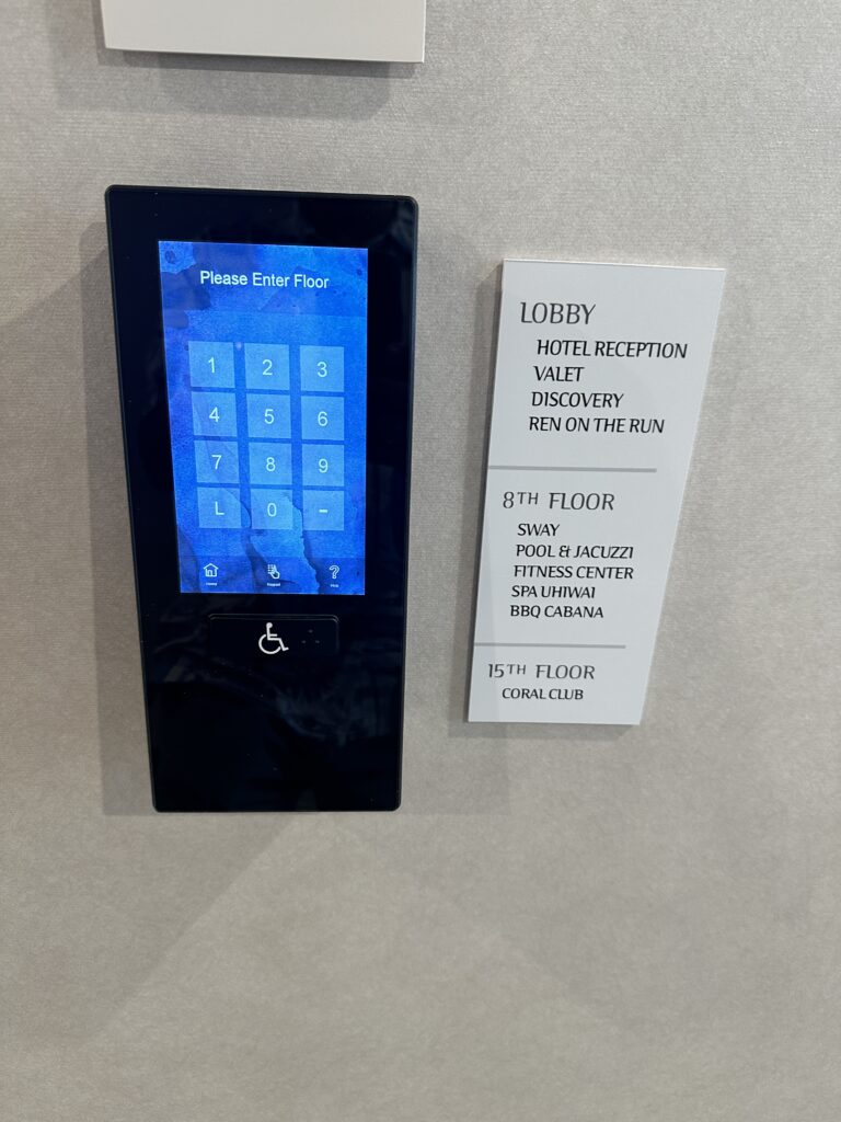 a electronic device with a blue screen and a white sign