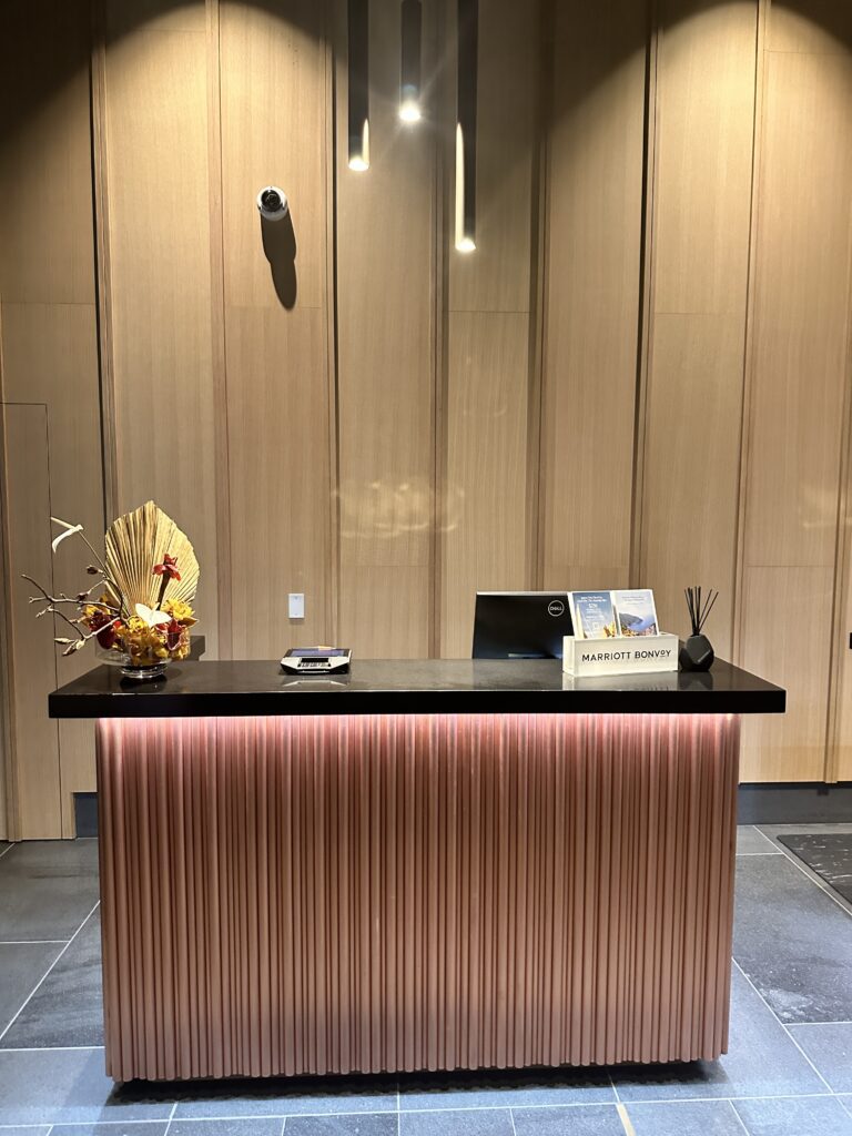 a desk with a flower arrangement on it