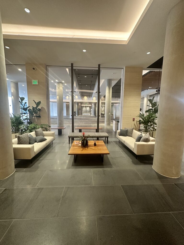 a lobby with a coffee table and couches