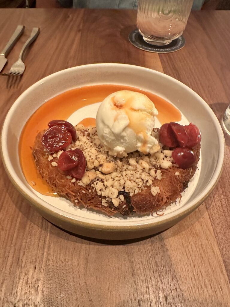 a bowl of food with ice cream and fruit