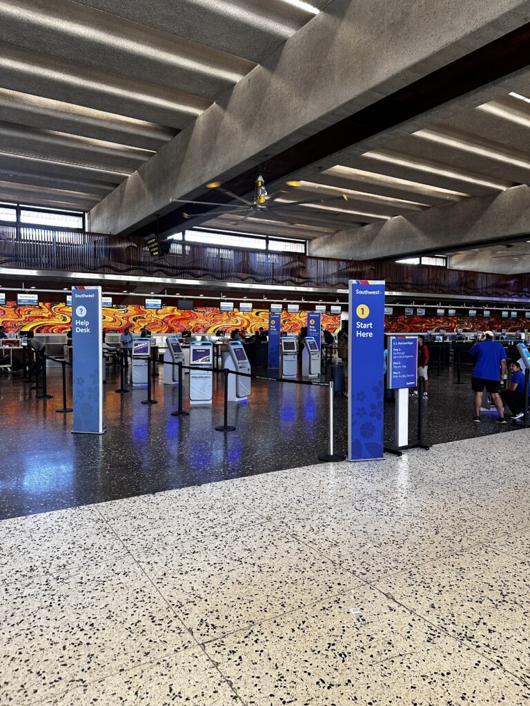 a group of people in an airport terminal