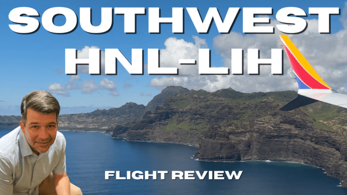 wing tip of Southwest Airlines Boeing 737 Max 8 over the cliffs on Lihue Kauai