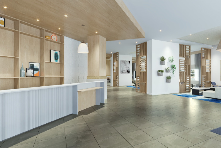 a lobby with a reception desk and shelves