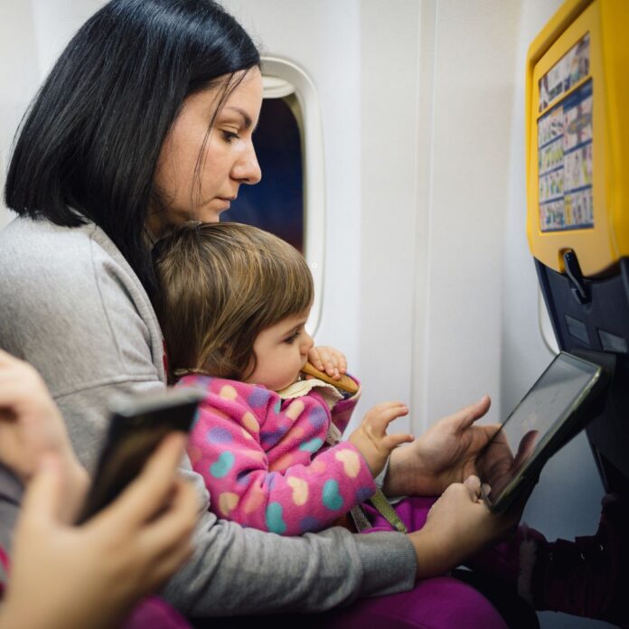 a woman and a child on a plane