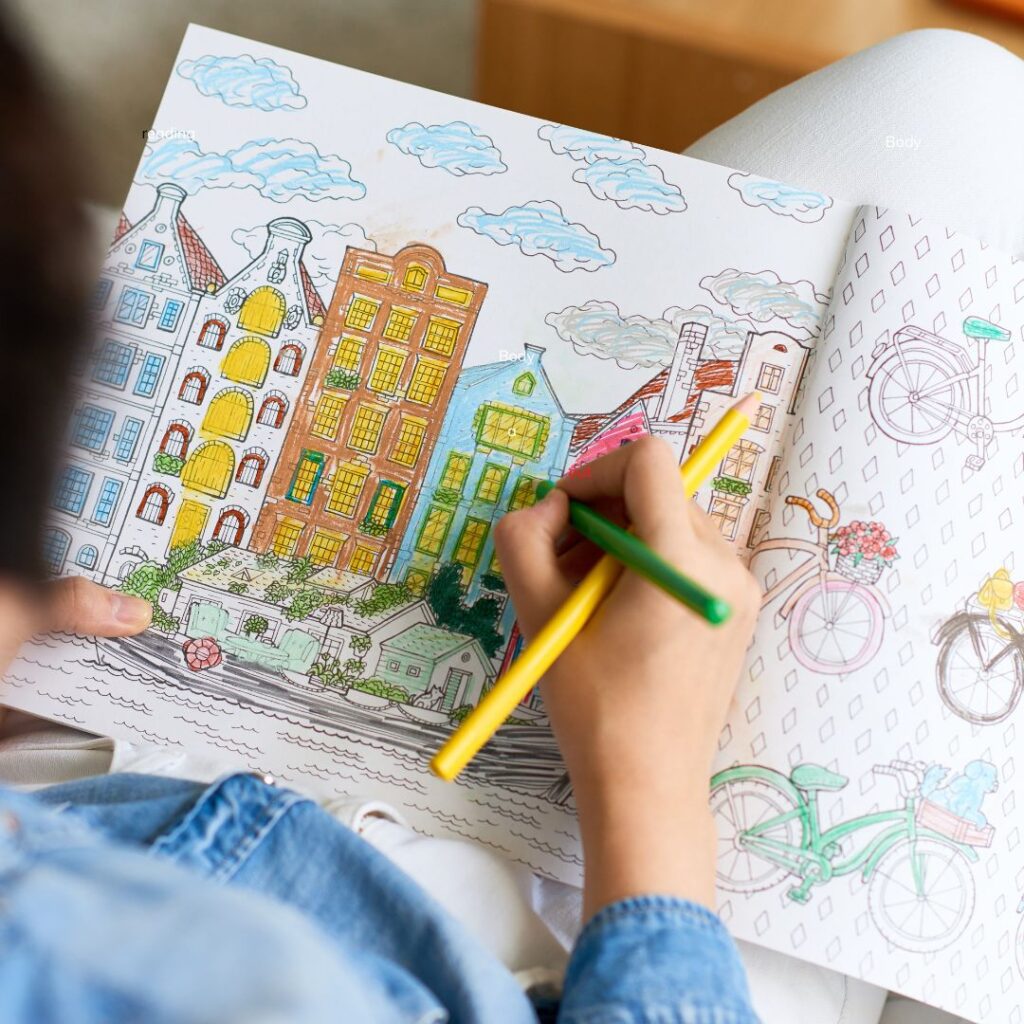 a person coloring a book