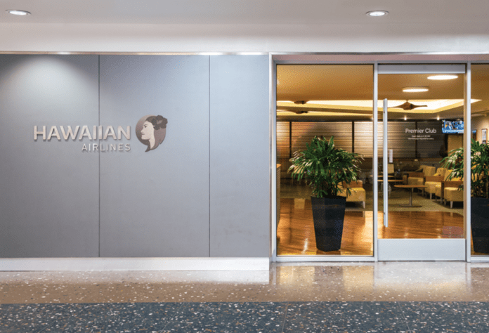 a building with glass doors and a sign