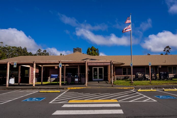 a building with a flag on the pole