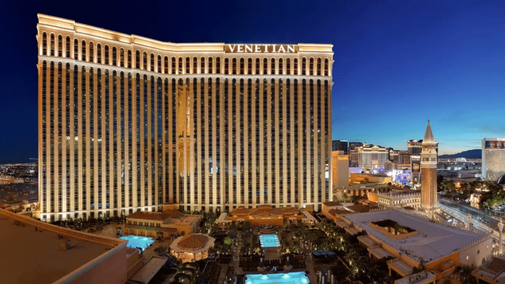 a large building with lights on it with Monte Carlo Resort and Casino in the background