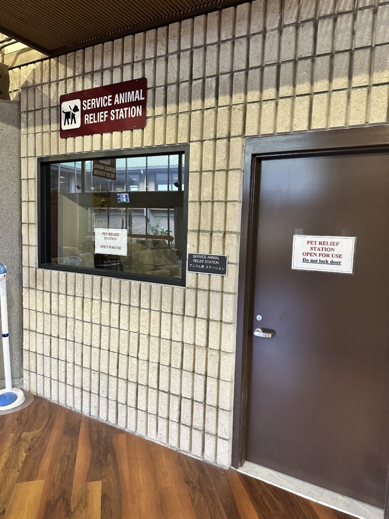 a door and a sign on a brick wall