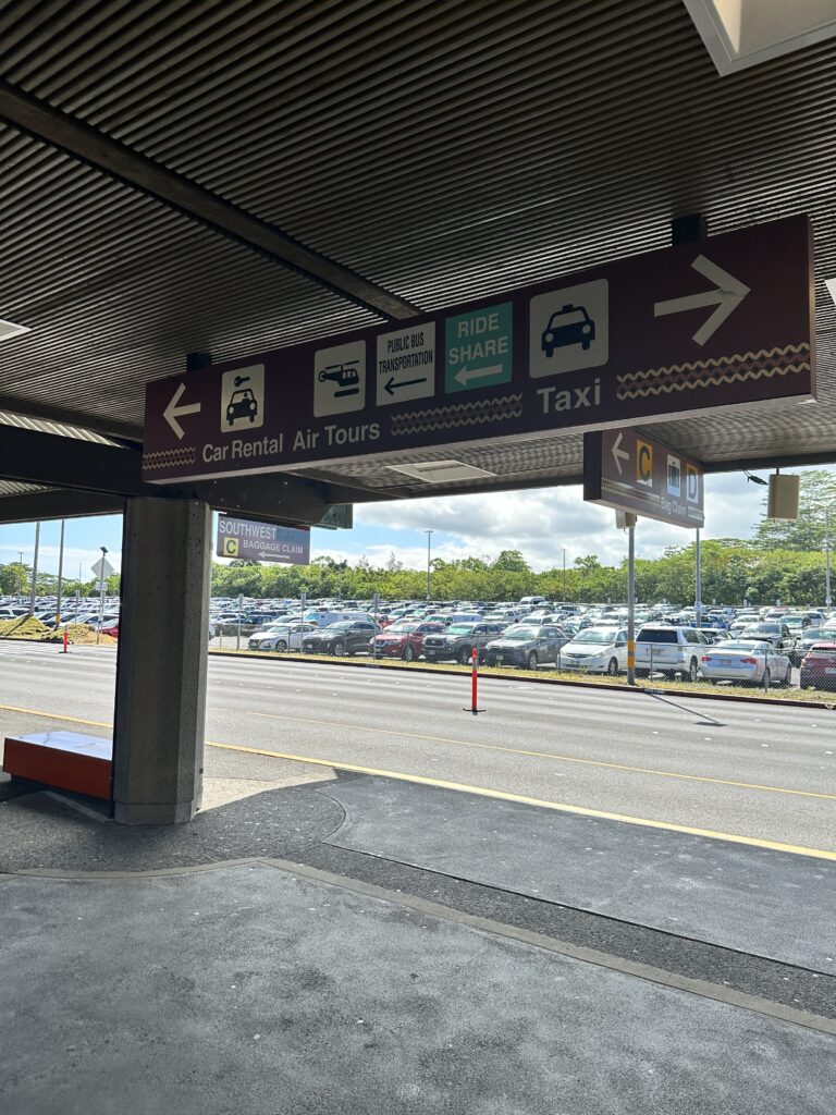 a parking lot with cars in the background