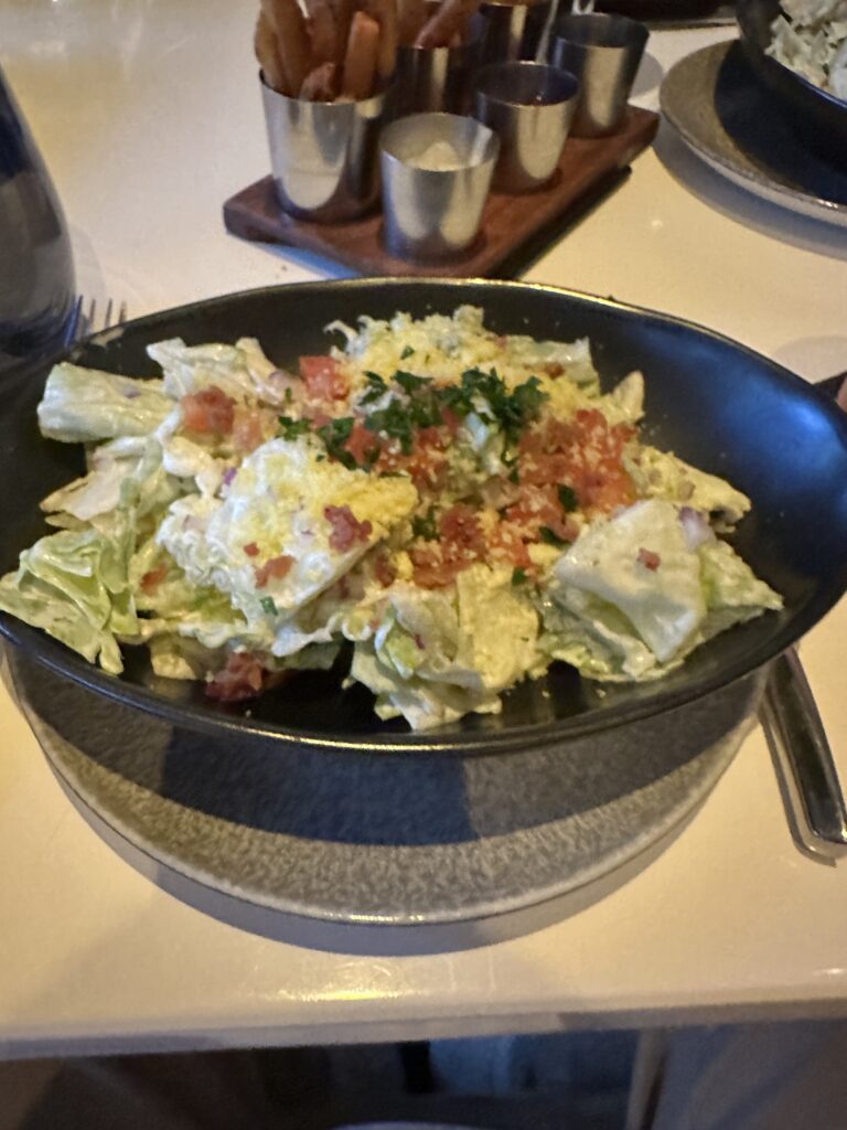 a bowl of salad on a table