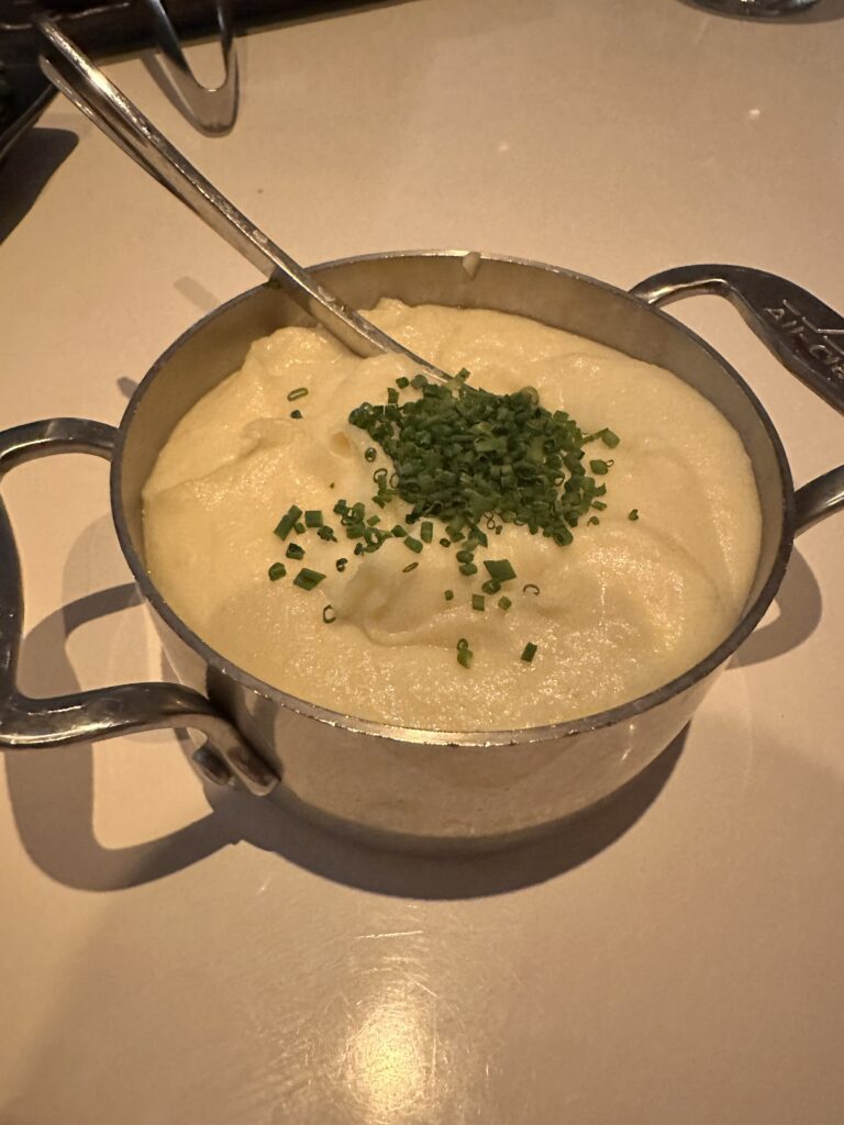 a pot of soup with a spoon