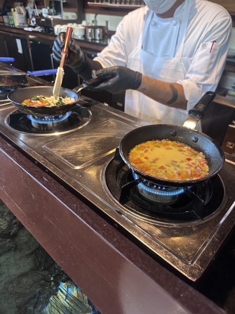 a person cooking food on a stove