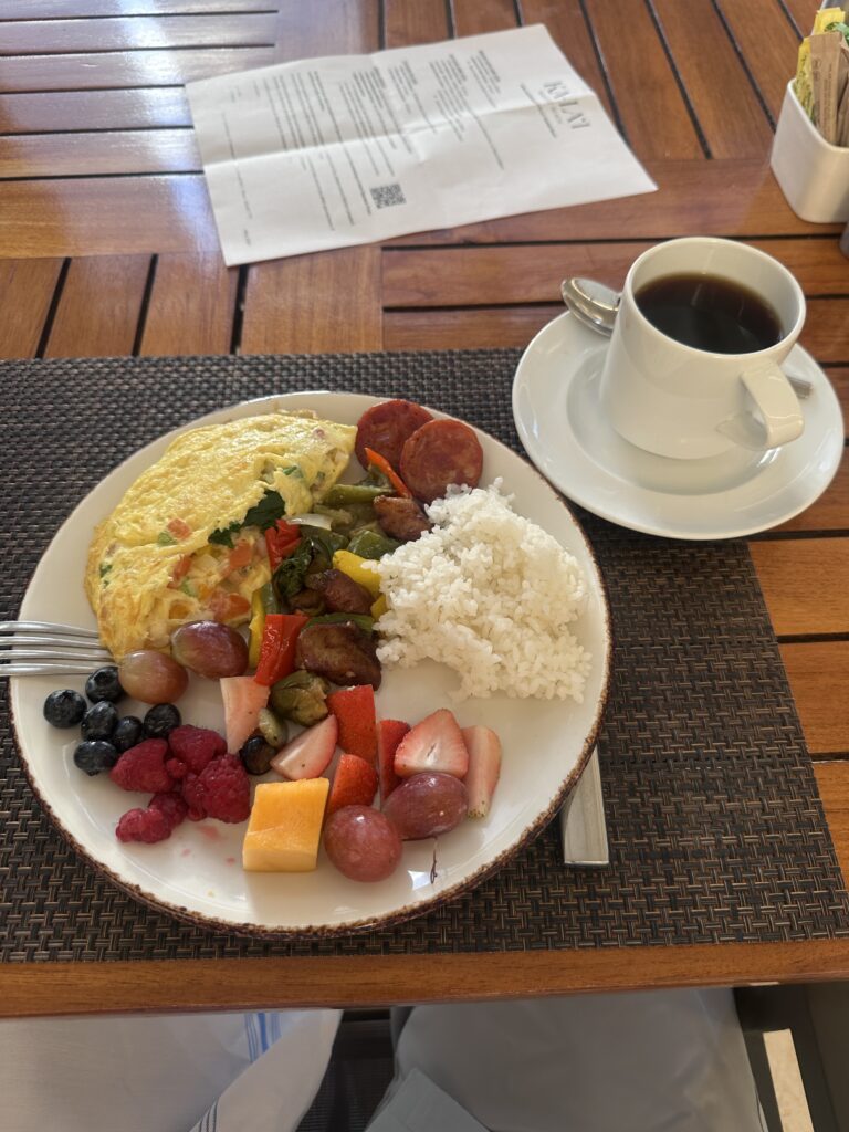 a plate of food and a cup of coffee