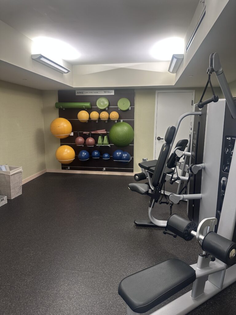 a room with exercise equipment and exercise equipment