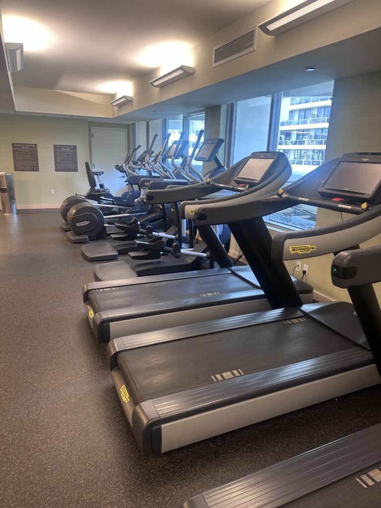 a group of treadmills in a gym