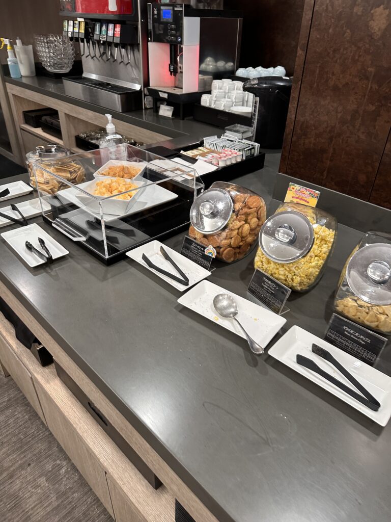 a buffet table with food in containers