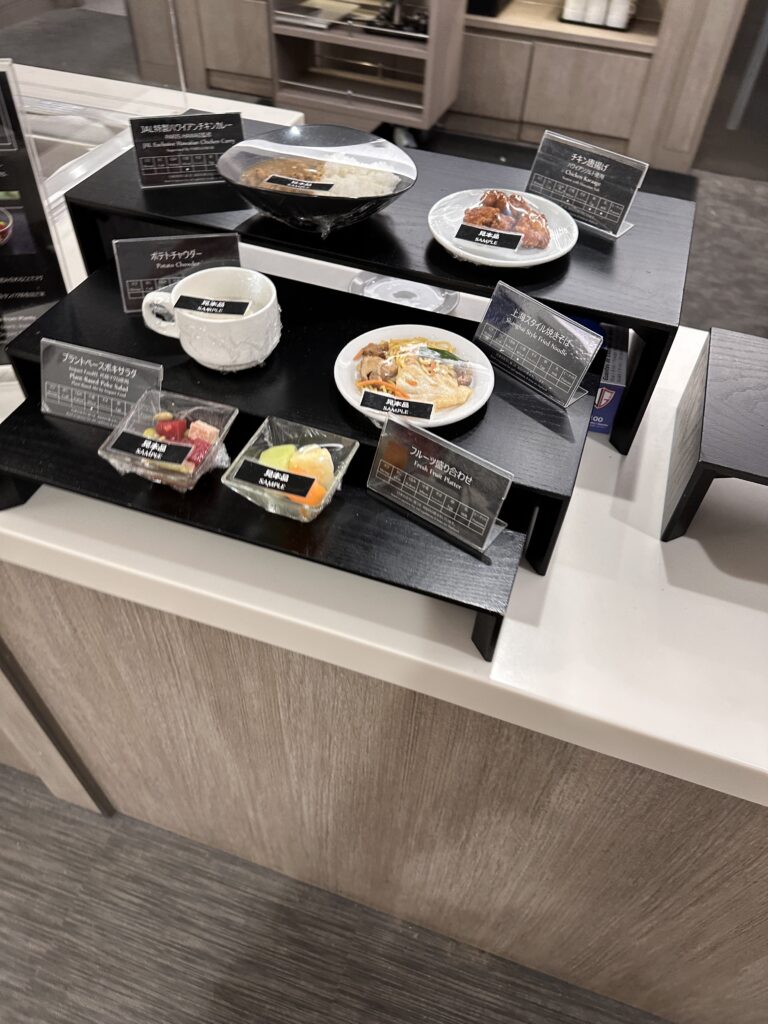 a black tray with plates of food on it