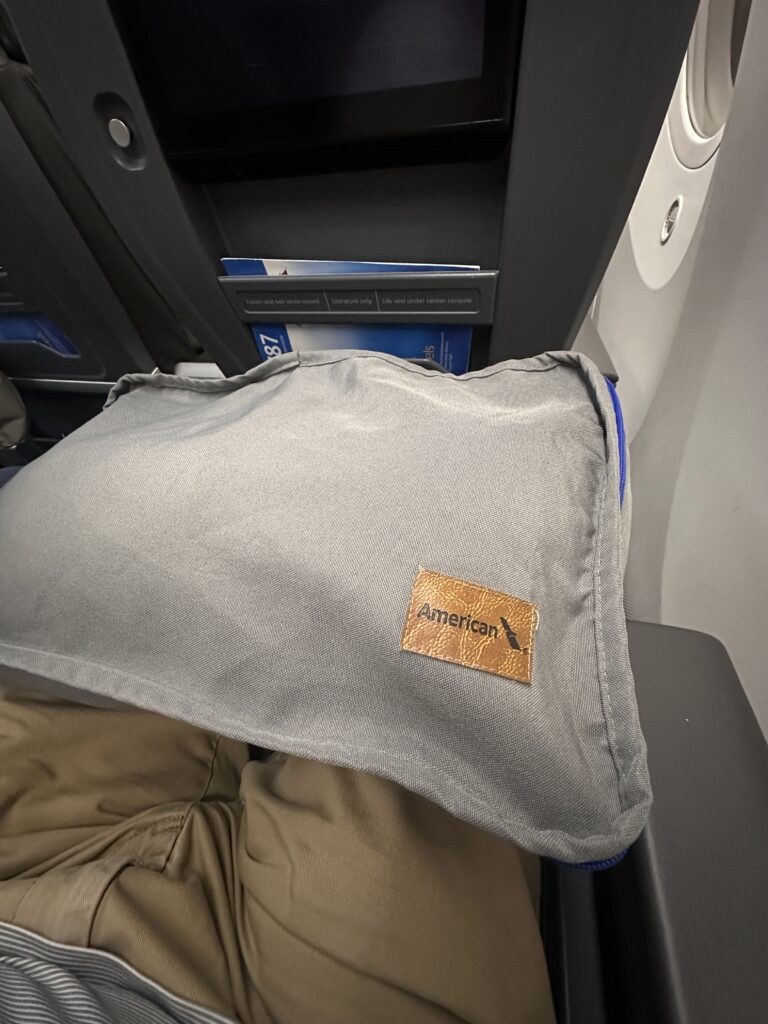 a pillow on a person's lap