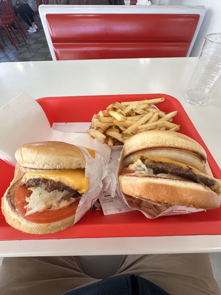 a tray of burgers and fries