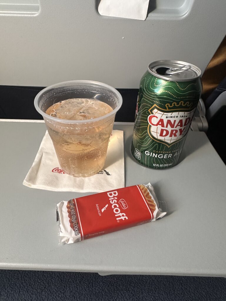 a beverage can and a drink on a table