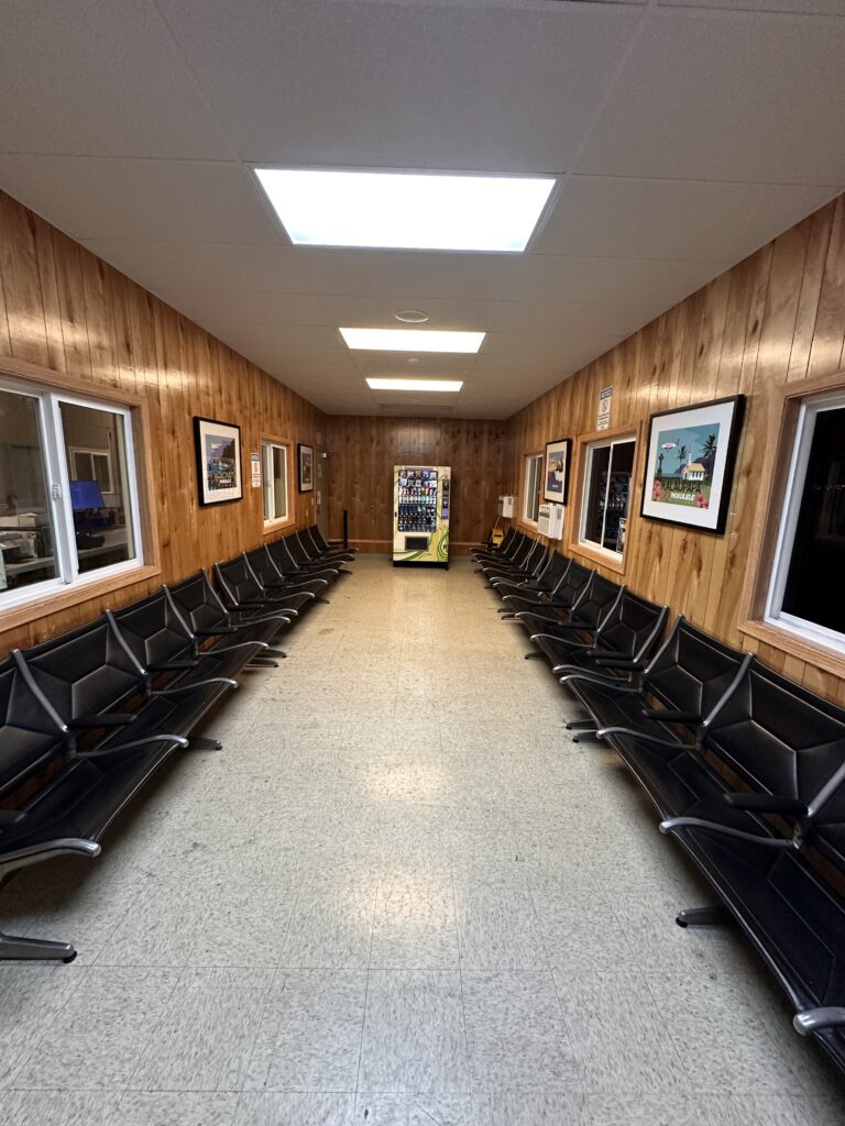 a row of chairs in a hallway