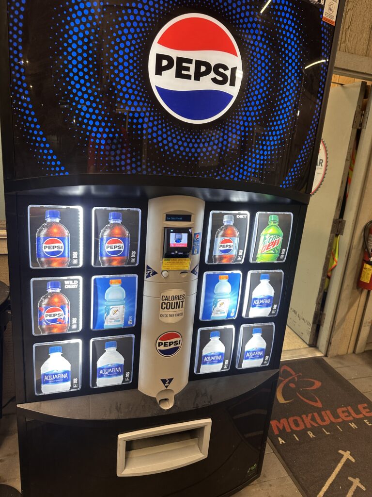 a vending machine with a variety of soda bottles