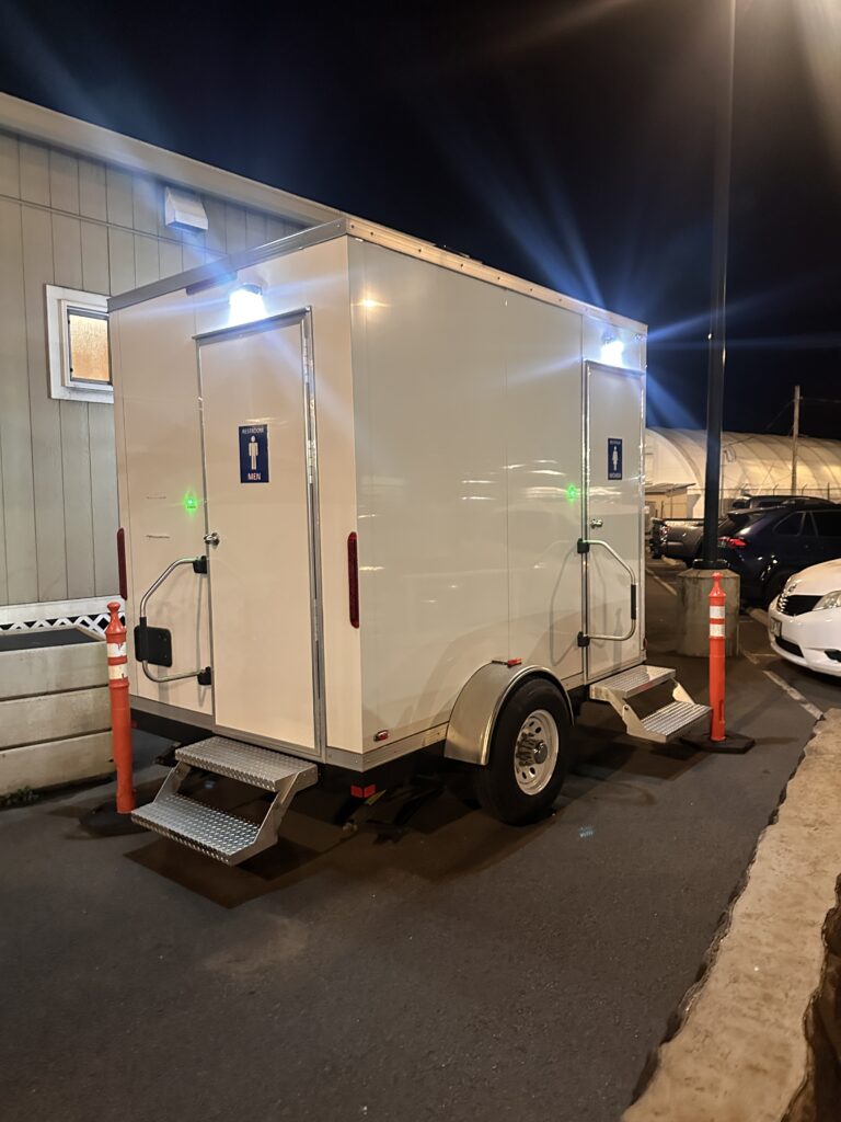 a white trailer with lights on the top