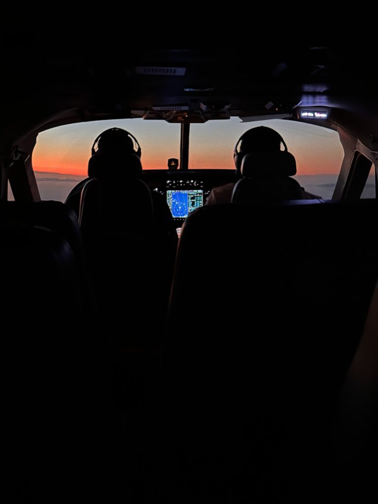 people in the cockpit of a plane