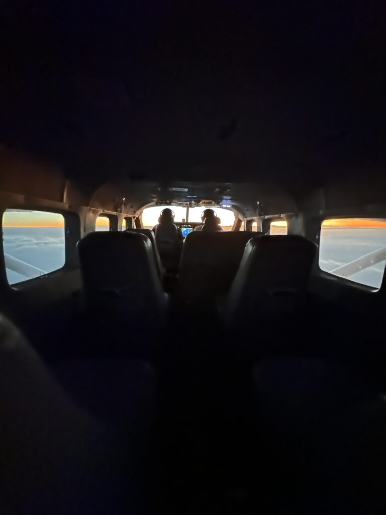 inside a plane with people in the back