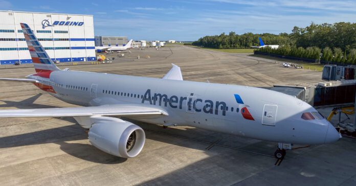 a large white airplane on a runway