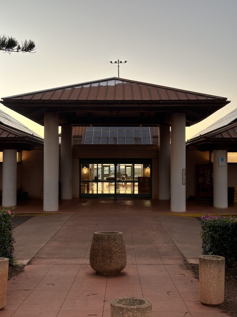 a building with a large stone pot in front of it Lānaʻi Airport